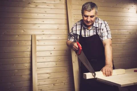 Senior carpenter working in his workshop Stock Photos