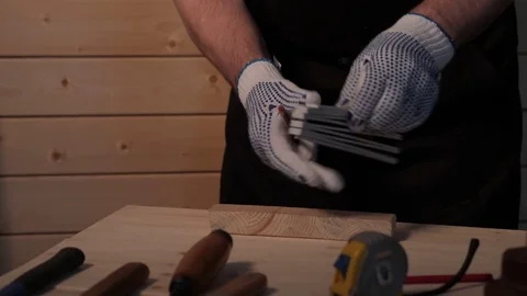 Senior carpenter working with straightedge Stock Footage 77213969