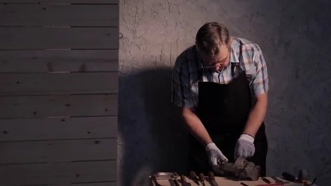 Senior carpenter working with vise Stock Footage 77109494