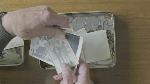 Senior caucasian man looking through a memory box Video stock 102288971