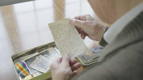 Senior caucasian man looking through a memory box Video stock 102293073