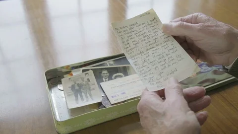 Senior caucasian man looking through a memory box Video stock 102293371