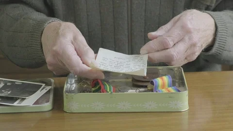 Senior caucasian man looking through a memory box Video stock 102304292