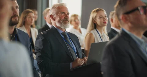 Senior Caucasian Man Using Laptop At Business Conference Stock Footage 255841206