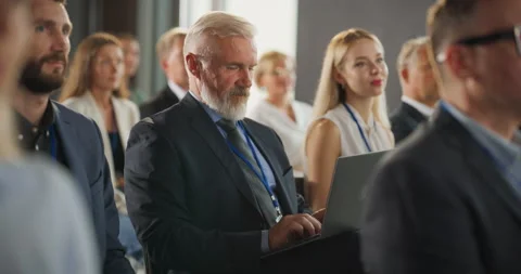 Senior Caucasian Man Using Laptop At Business Conference Stock Footage 255841246