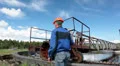 Senior Caucasian worker in a helmet maintaining at the water treatment plant HD Footage