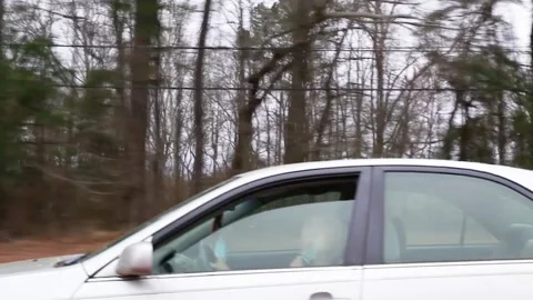 A senior on a cellphone while driving in Georgia Stock Footage 149534949