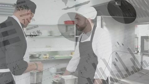 Senior chef prepping after measuring at kitchen counter, instructing line cook, Video stock 333936497