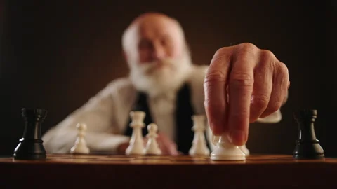 Senior Chess Player Thoughtfully Removes Key Opponent Piece Stock Footage 263149688