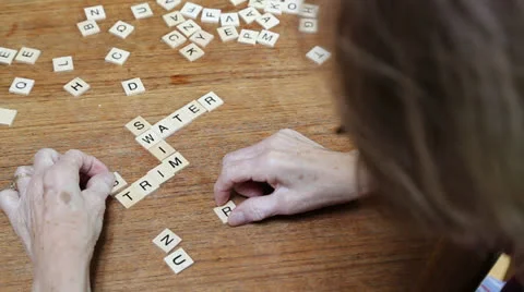 Senior Citizen doing a word puzzle Stock Footage 23934743