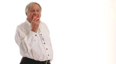 Senior citizen male eats apple 4 Video stock 24631637