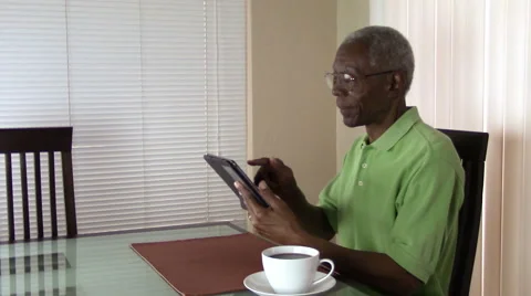 Senior citizen working with a tablet at home in Arizona. Stock Footage 48767278