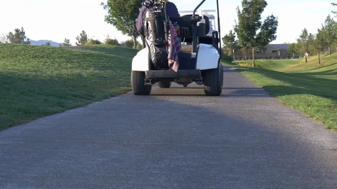 Senior Citizens in golf carts Stock Footage 100522038