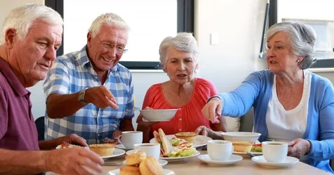 Senior citizens having breakfast Stock Footage 70548732