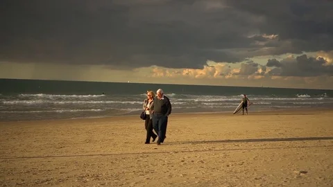 Senior couple on a beach Stock Footage 82704164