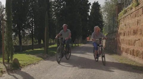 Senior couple on bicycles Stock Footage 65234087