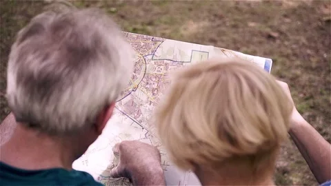 Senior couple checking map, top view Stock Footage 88413304