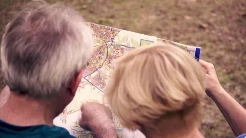 Senior couple checking map, top view Stock Footage 88414784