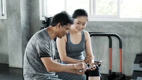 Senior couple checking out their mobile phone. Stock Footage 103438474