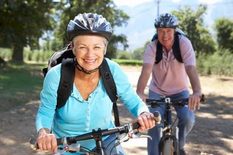 Senior couple on country bike ride Stock Photos