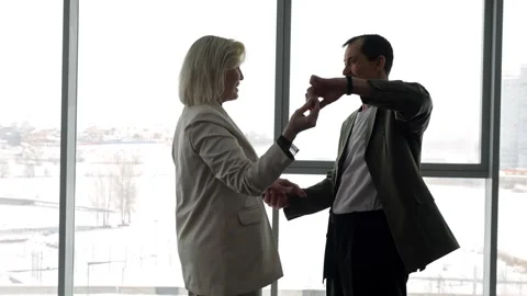 Senior couple dancing by the window in winter Video stock 308434656