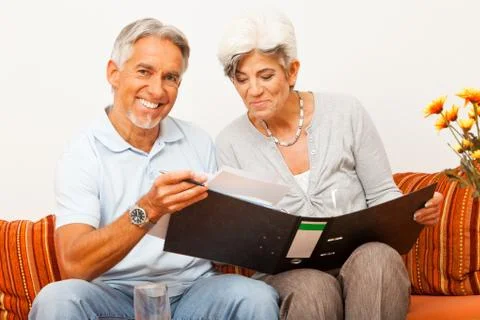Senior Couple Doing Paperwork Photos