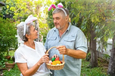 Senior couple with easter basket Stock Photos