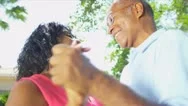 Senior Couple Enjoying Retirement Living Dancing Outdoors Stock Footage