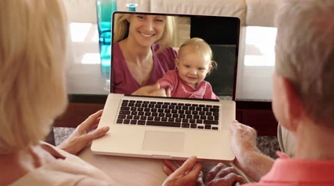 Senior couple enjoying video online with daughter and grandchild. Stock Footage 43682053