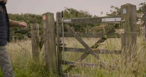 Senior couple entering ranch gate Stock Footage 59899697