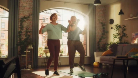 Senior Couple Exercising at Home Stock Footage 192800511