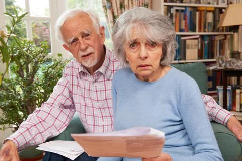 Senior Couple Going Through Finances Looking Worried Stock Photos