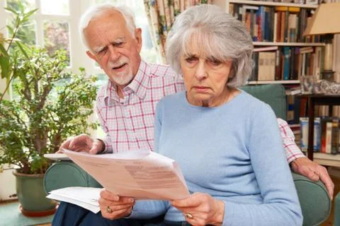 Senior Couple Going Through Finances Looking Worried Stock Photos