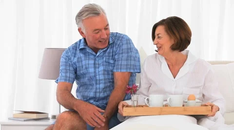 Senior couple having  breakfast together Stock Footage 1066868