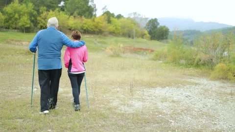 Senior couple having fun exploring during trekking day in mountain forest Video stock 170249258