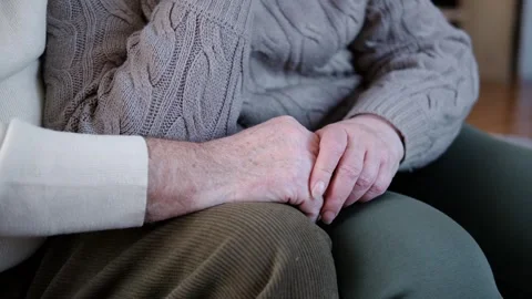Senior Couple holding hands. Elderly Man and Woman. Two loving old hands being Stock Footage 303569497