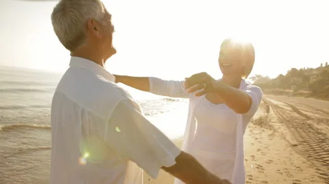 Senior couple hugging on beach Stock Footage 43623594