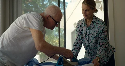 Senior couple ironing. 스톡 동영상 88374337