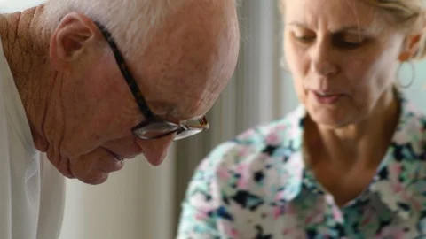 Senior couple looking down. Stockbeeldmateriaal 88374284