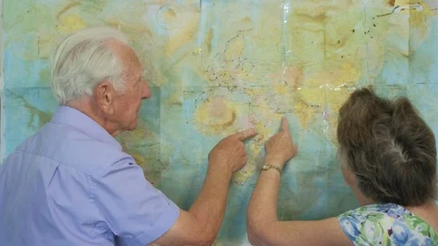Senior couple looking at an old map Video stock 89637485