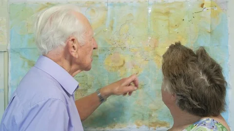 Senior couple looking at an old map Video stock 89639519