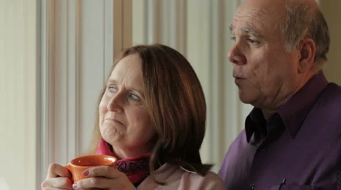 Senior couple looking out window 動画素材 1059197