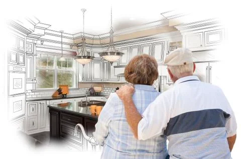 Senior Couple Looking Over Custom Kitchen Design Drawing and Photo Combinatio Ilustração Stock
