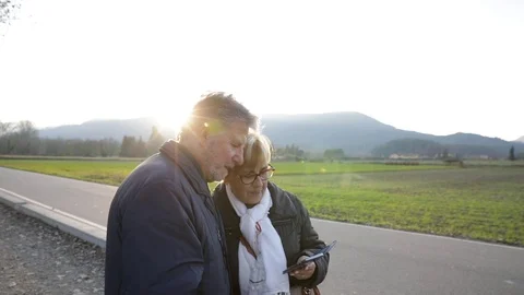 Senior couple looking at the phone Stock Footage 101739934