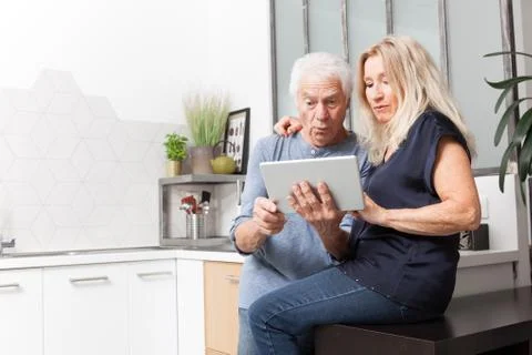Senior couple looking at a tablet computer Foto stock