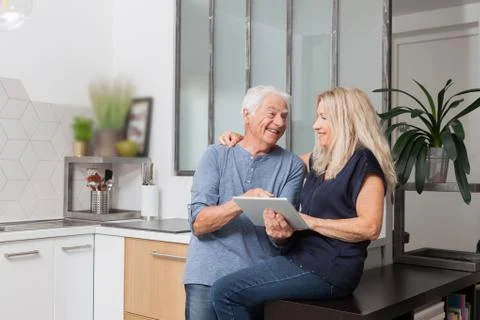 Senior couple looking at a tablet computer Stock Photos