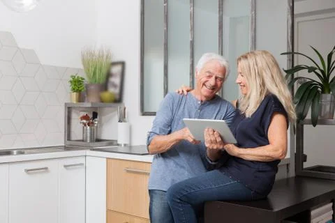 Senior couple looking at a tablet computer Stock Photos