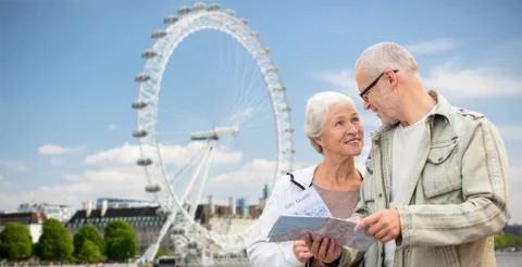Senior couple with map talking over london Fotos Stock