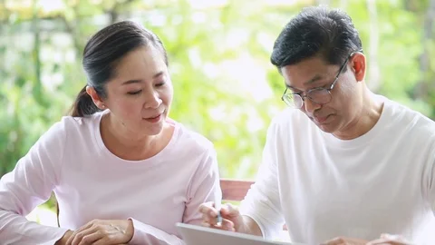Senior couple meeting financial adviser for investment at home. Stock Footage