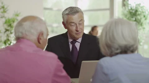 Senior couple in meeting with financial advisor or bank manager Stock Footage 44672753